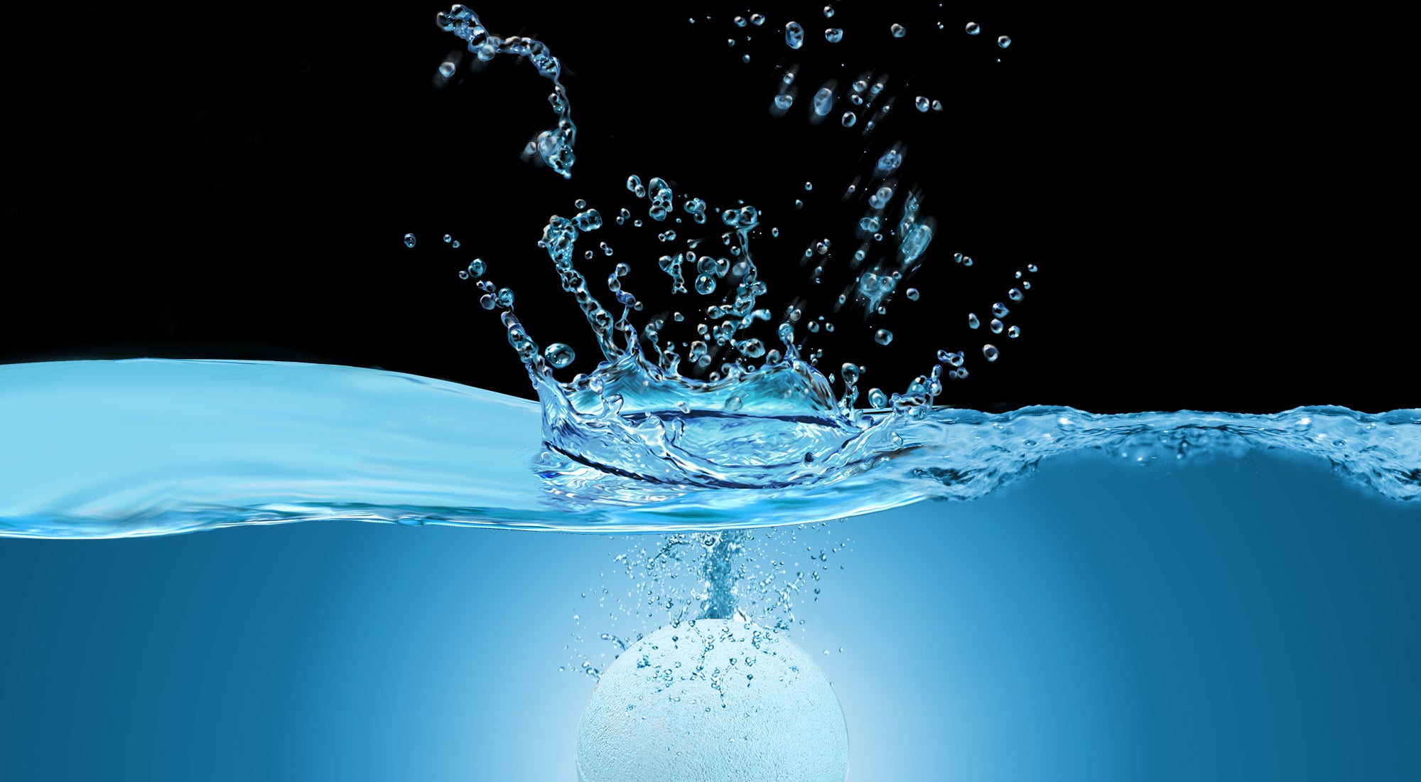 White Muscle Rehab bath bomb splashing into blue water, creating droplets and ripples against a black background, symbolizing freshness, relaxation, and the start of a soothing soak.