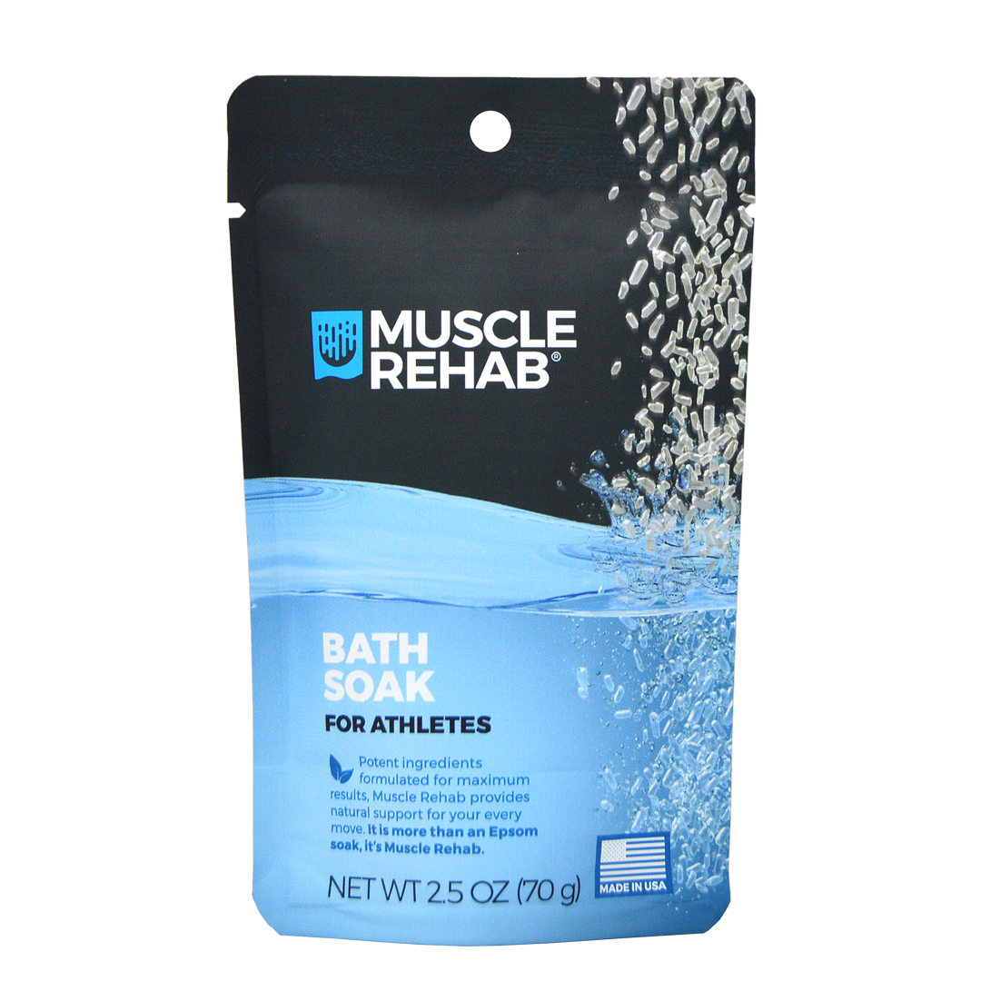 A travel size pouch of Muscle Rehab Bath Soak for Athletes with a graphic of bubbles and water, indicating the product is a bath soak.
